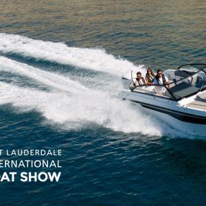 The Yamarin 80 DC is driving toward the right edge of the sea. There are three people on board. The FLIBS logo is visible in white in the lower left corner.